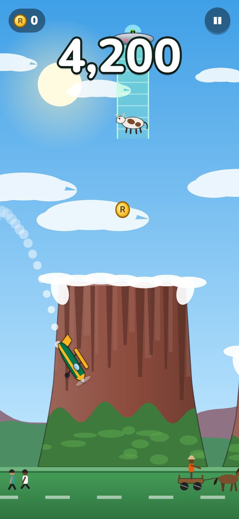 Air Flappy gameplay: a plane flying past Table Mountain with a UFO and an abducted cow above
